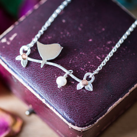 Silver bird necklace sales